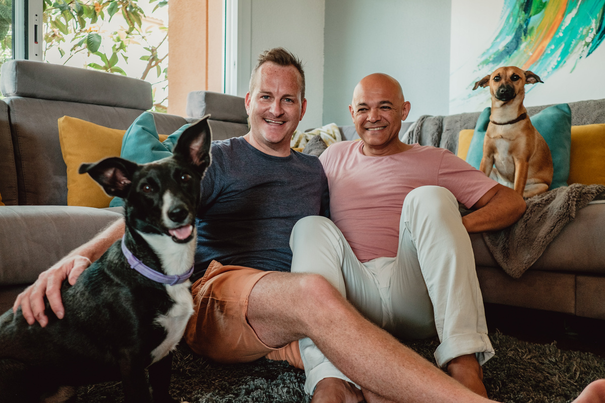 LGBTQ Couple with Their Pet Dogs in the Living Room
